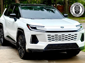 White SUV with tinted windows on a driveway